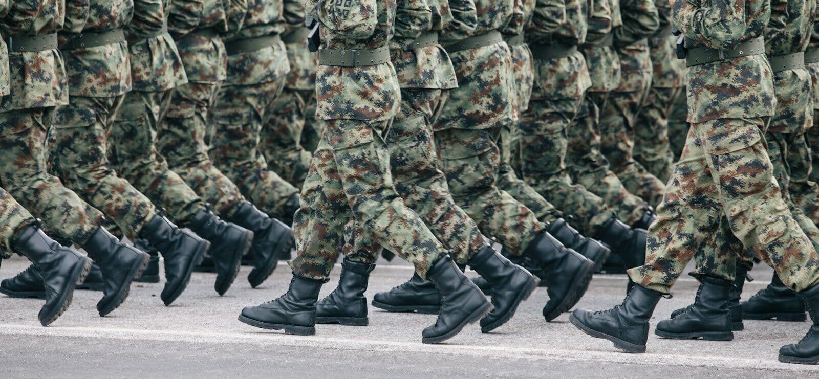 men in green and brown camouflage uniform